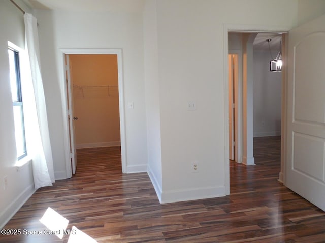 interior space with dark wood-style floors and baseboards