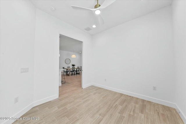 empty room with light wood-style flooring, visible vents, baseboards, recessed lighting, and a ceiling fan