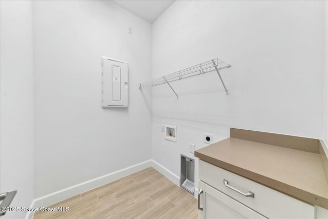 laundry room featuring electric dryer hookup, light wood-style floors, electric panel, baseboards, and washer hookup