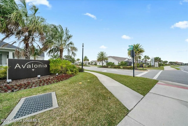 surrounding community with a yard and a residential view
