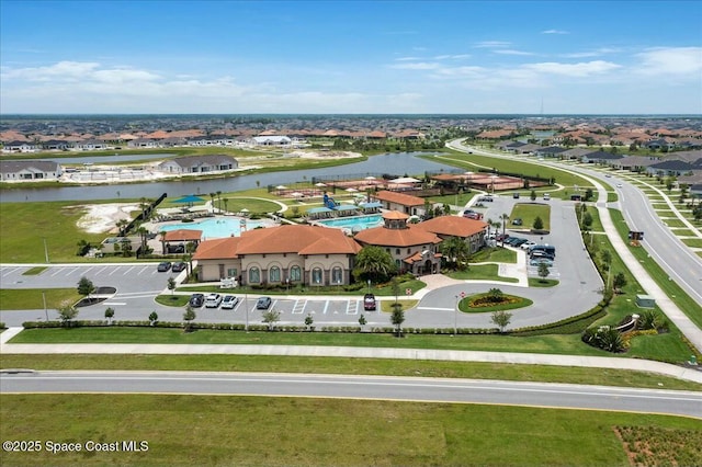 bird's eye view featuring a water view and a residential view
