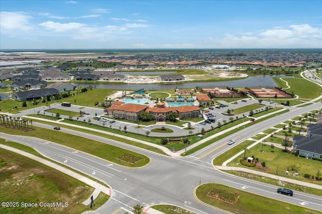 birds eye view of property featuring a residential view and a water view