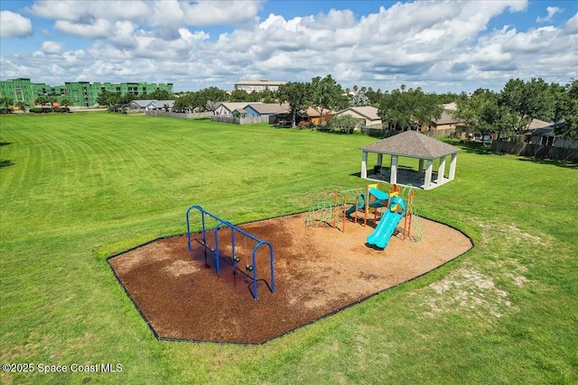 community jungle gym with a lawn and a gazebo