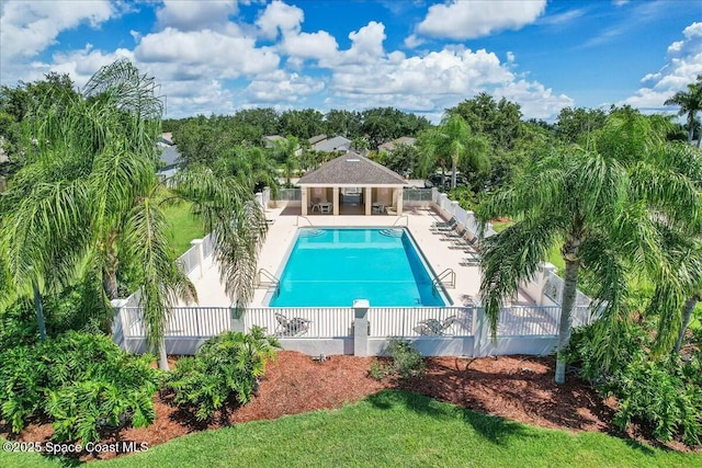 pool featuring a patio area and fence private yard
