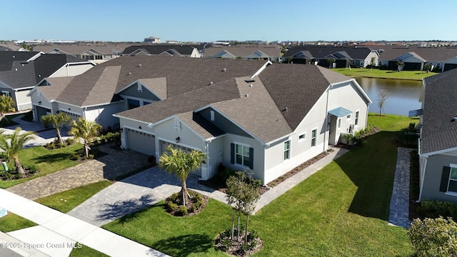 aerial view with a residential view and a water view