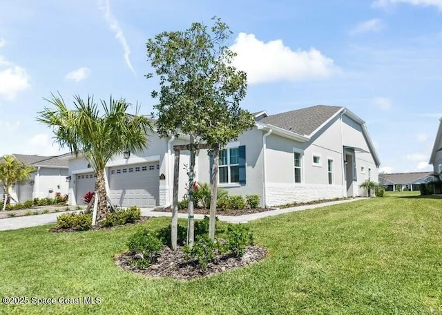 view of front of home with stucco siding, driveway, an attached garage, and a front yard