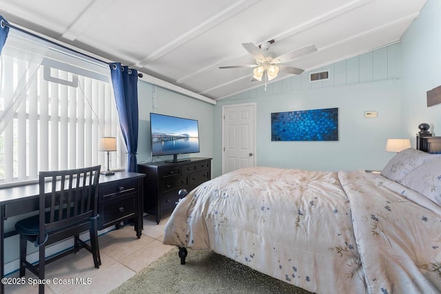 bedroom featuring tile patterned floors, visible vents, lofted ceiling, and a ceiling fan