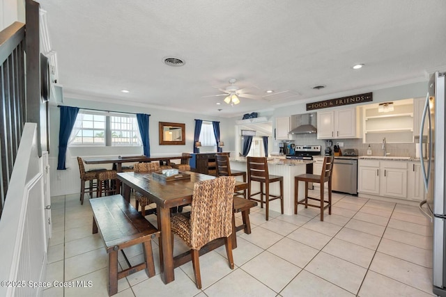 dining area with visible vents, recessed lighting, light tile patterned flooring, crown molding, and ceiling fan