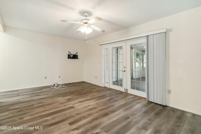 empty room featuring french doors, a textured ceiling, wood finished floors, and a ceiling fan