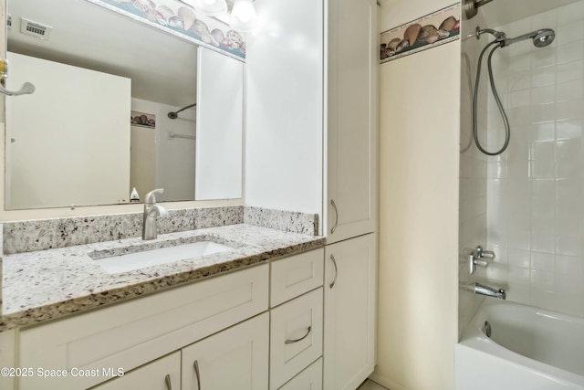 full bath with vanity, visible vents, and shower / bathtub combination