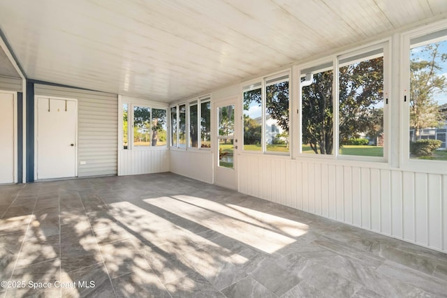 unfurnished sunroom with wooden ceiling