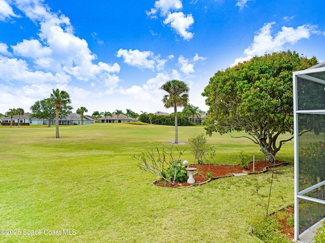 4942 Worthington Cir, Rockledge, FL 32955 - view of green lawn with glass enclosure and a residential view