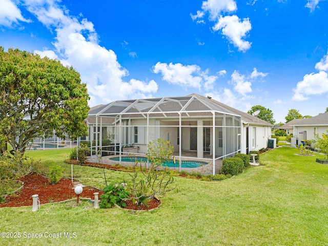 4942 Worthington Cir, Rockledge, FL 32955 - back of house with a yard, an outdoor pool, and a patio