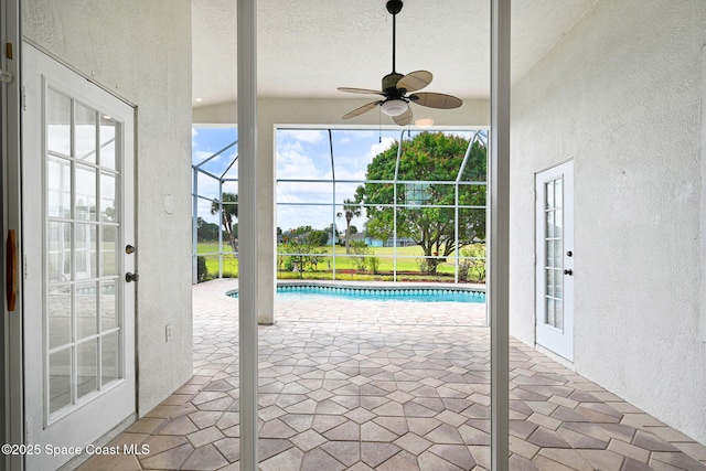4942 Worthington Cir, Rockledge, FL 32955 - unfurnished sunroom with ceiling fan and a pool
