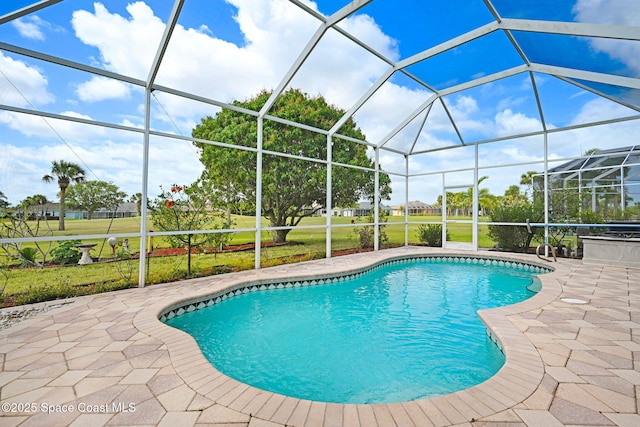 4942 Worthington Cir, Rockledge, FL 32955 - swimming pool with a patio area, glass enclosure, and a lawn