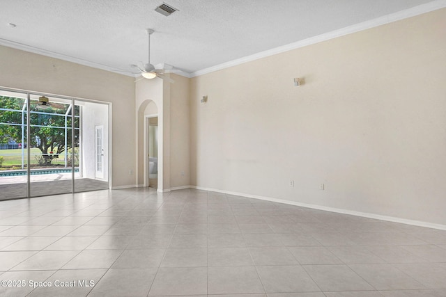 4942 Worthington Cir, Rockledge, FL 32955 - spare room featuring ceiling fan, crown molding, arched walkways, a textured ceiling, and light tile patterned flooring