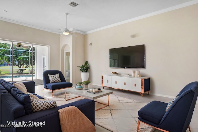 4942 Worthington Cir, Rockledge, FL 32955 - living area with crown molding, a ceiling fan, arched walkways, and a sunroom