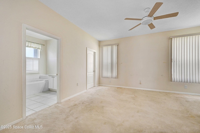 4942 Worthington Cir, Rockledge, FL 32955 - carpeted spare room featuring a ceiling fan and tile patterned floors