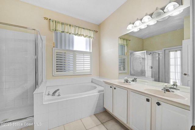 4942 Worthington Cir, Rockledge, FL 32955 - full bathroom with plenty of natural light, a stall shower, tile patterned floors, and double vanity