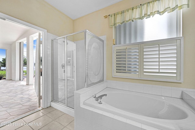 4942 Worthington Cir, Rockledge, FL 32955 - full bathroom featuring a garden tub, a stall shower, and tile patterned floors