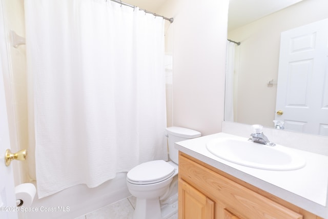 bathroom featuring vanity, tile patterned floors, toilet, and shower / bath combo with shower curtain