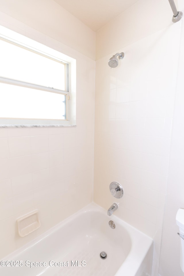 full bathroom with toilet and shower / washtub combination