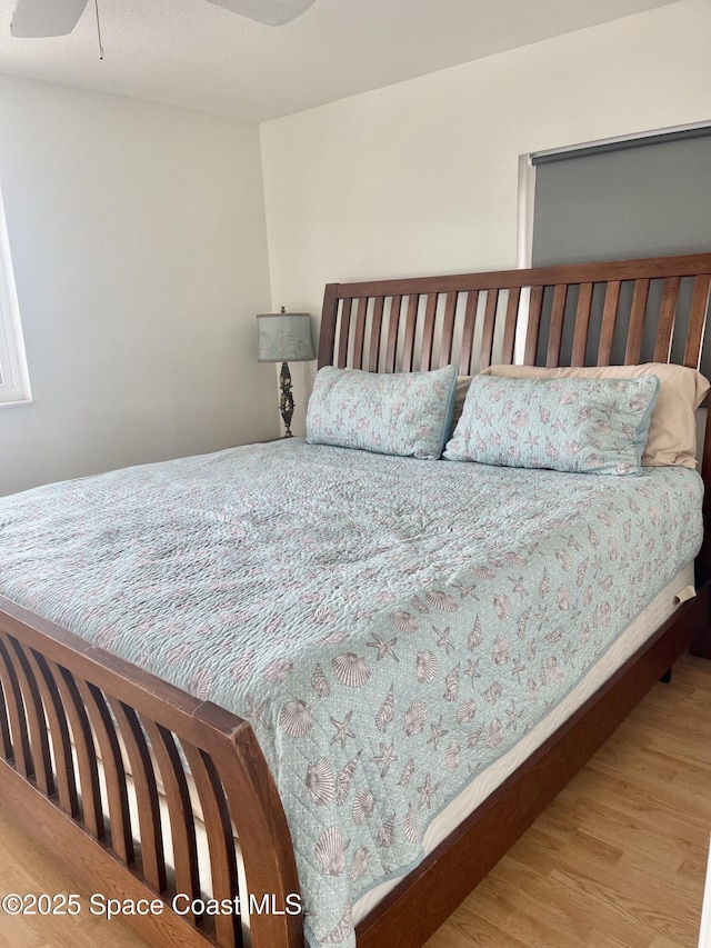 bedroom featuring wood finished floors