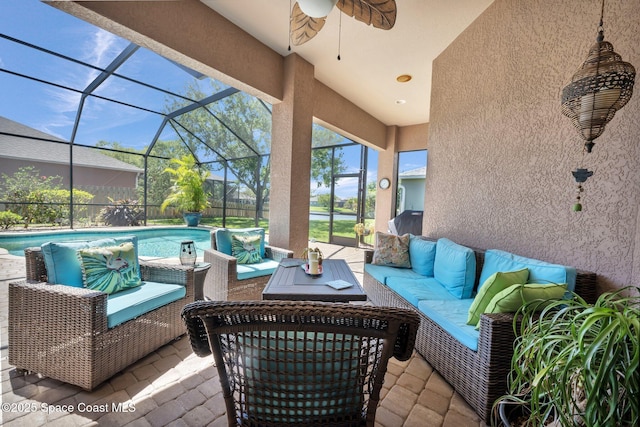 view of patio with a lanai, an outdoor pool, an outdoor hangout area, and ceiling fan