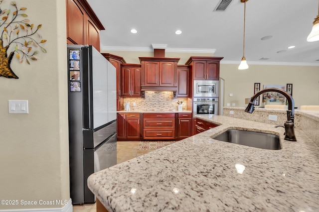 kitchen with visible vents, a sink, decorative backsplash, stainless steel appliances, and dark brown cabinets