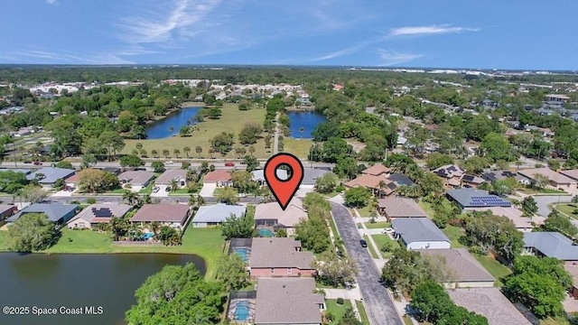 bird's eye view with a residential view and a water view