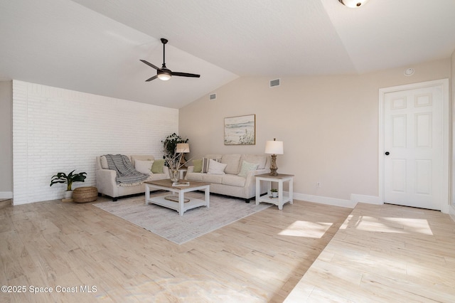 living area with wood finished floors, visible vents, baseboards, lofted ceiling, and ceiling fan