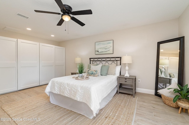 bedroom featuring visible vents, baseboards, ceiling fan, light wood-type flooring, and recessed lighting