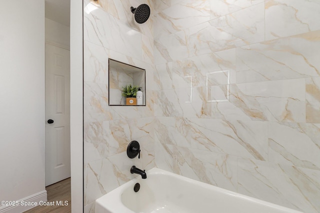 full bathroom featuring tub / shower combination and wood finished floors