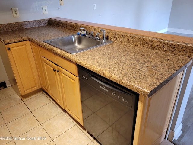 kitchen featuring a sink, dishwasher, light brown cabinets, and light tile patterned floors