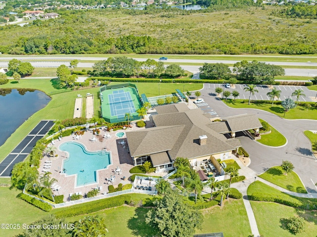 birds eye view of property with a water view