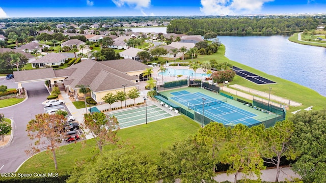 drone / aerial view with a residential view and a water view