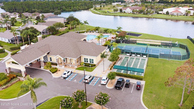 birds eye view of property with a water view and a residential view