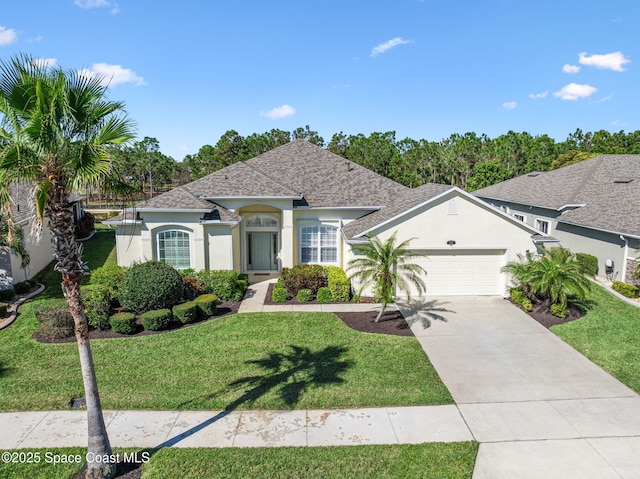 single story home featuring stucco siding, a garage, concrete driveway, and a front yard