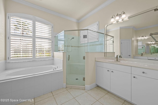 bathroom featuring tile patterned flooring, crown molding, a stall shower, a bath, and vanity