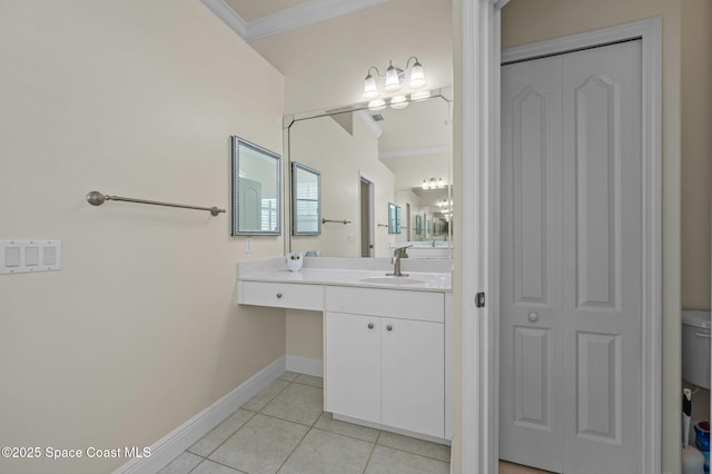 bathroom with a closet, crown molding, tile patterned flooring, baseboards, and vanity