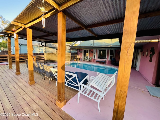 outdoor pool featuring a wooden deck