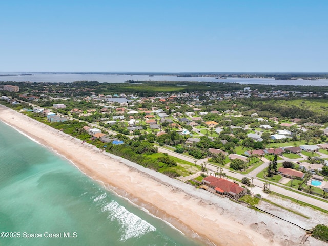 bird's eye view with a water view and a view of the beach