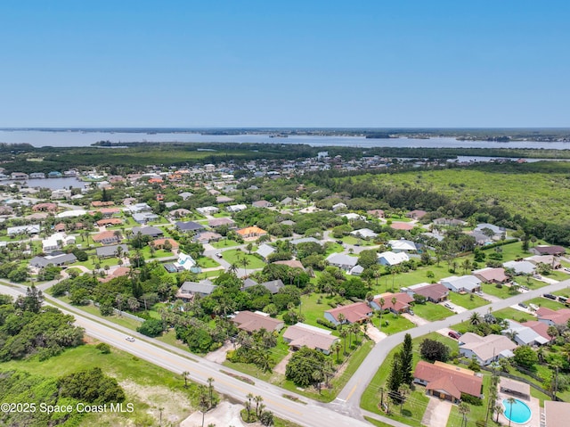 birds eye view of property featuring a residential view and a water view