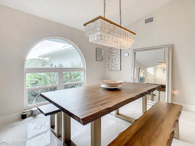 dining room featuring visible vents and baseboards