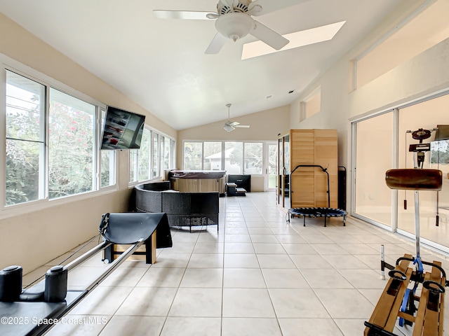 living area featuring light tile patterned floors, ceiling fan, and lofted ceiling