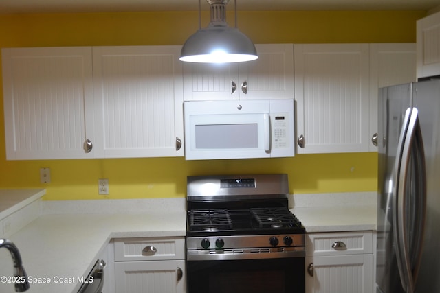 126 Plover Ln Unit 632, Rockledge, FL 32955 - kitchen featuring appliances with stainless steel finishes, white cabinets, and light countertops