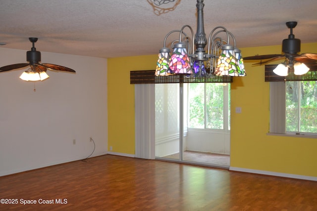 126 Plover Ln Unit 632, Rockledge, FL 32955 - unfurnished room with a ceiling fan, wood finished floors, baseboards, and a textured ceiling