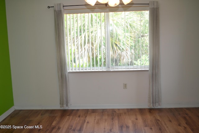 126 Plover Ln Unit 632, Rockledge, FL 32955 - empty room with wood finished floors and baseboards