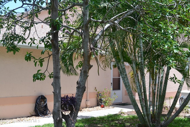 126 Plover Ln Unit 632, Rockledge, FL 32955 - view of side of home with stucco siding
