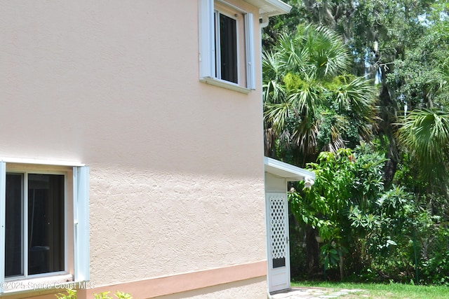 126 Plover Ln Unit 632, Rockledge, FL 32955 - view of side of property with stucco siding